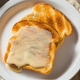 Maple cream spread on toast on white plate